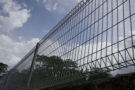 metal wire mesh fence fabrication|wire mesh bottom of fence.